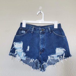Vintage Wrangler dark wash denim cutoff shorts.